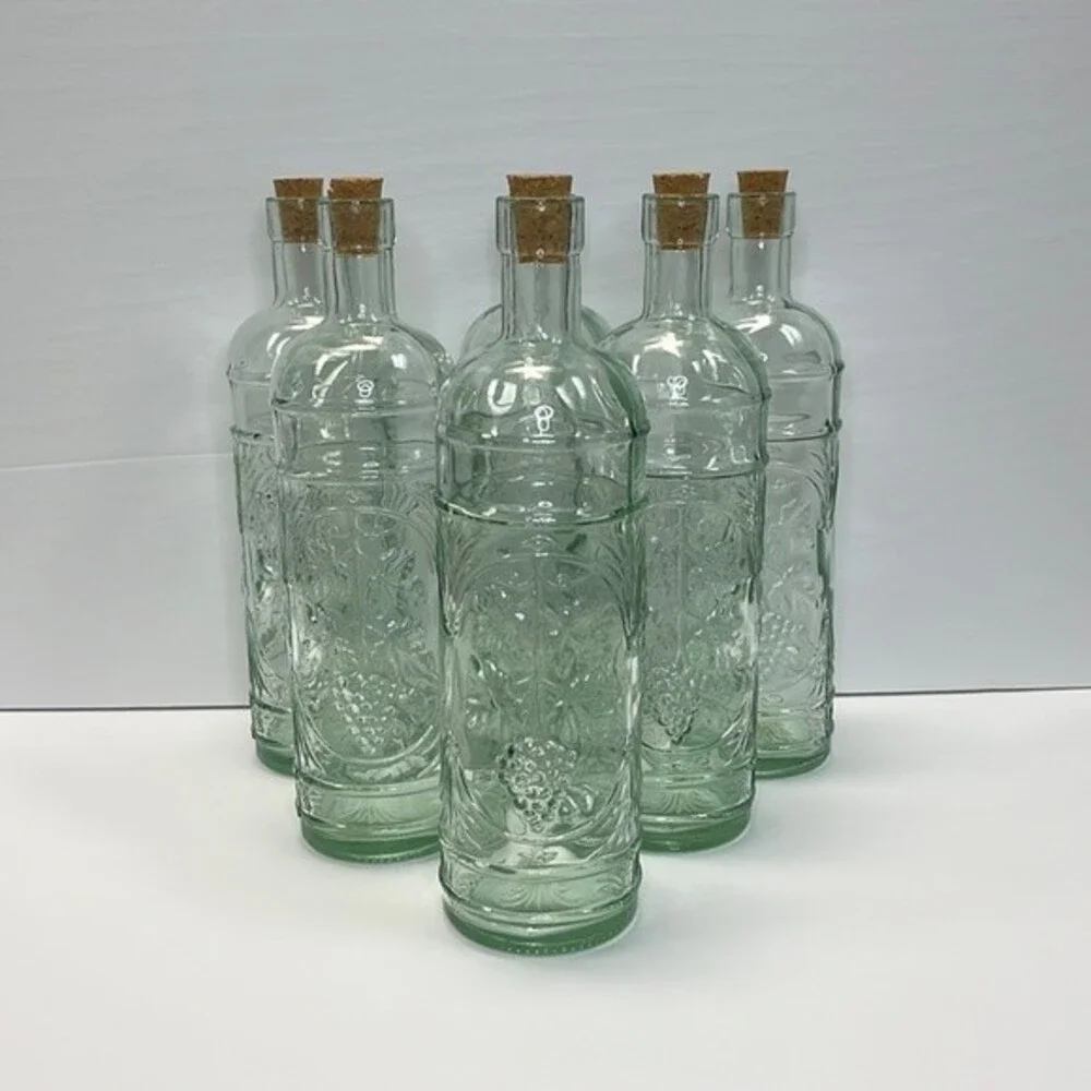 William Sonoma made in Spain Embossed Clear Green Glass Bottles set of 3